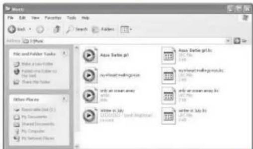 Music File Edit View Favorites Tools Help Back Search Folder Address: 12 Music File and Folder Tools Write a new folder Paste into a folder to the old Share the folder Other Places Enterable Us (1) My Documents Shared Documents My Computer My Settings Files Audio Barlie.gpt my/mixed/makingbox only an ocean away write in July write in July (1) write in July (2)