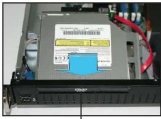 Device rear panel with visible drive labels and warning signs, showing a blue chip on the cover
