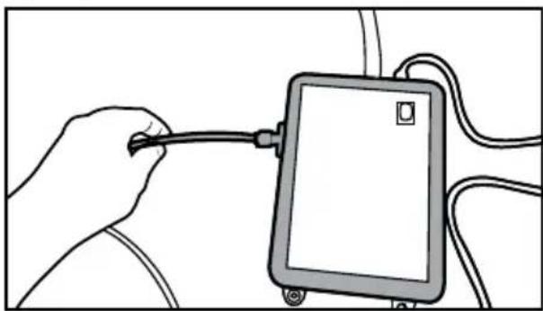 Illustration of a hand holding a cable inserted into a tablet device (no text or symbols visible).