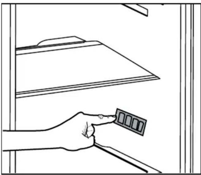 Line drawing of a hand holding a small object above a shelf (no text or symbols).
