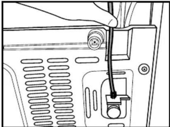 Line drawing of a hand inserting a cable into a device panel (no text or symbols).