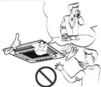 Illustration showing a person using a device with a speech bubble and a 'no' symbol below, suggesting a noise or prohibition context.