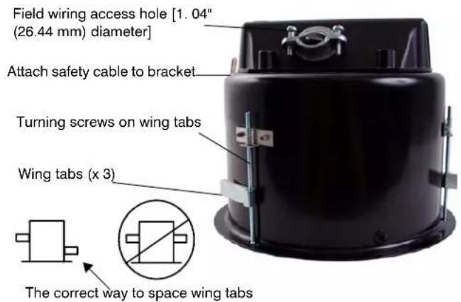 Field wiring access hole [1.04" (26.44 mm) diameter] Attach safety cable to bracket Turning screws on wing tabs Wing tabs (x 3) The correct way to space wing tabs