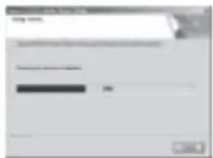 Scanned screenshot of a software interface with a dialog box and progress bar, likely from an older application or settings tool.