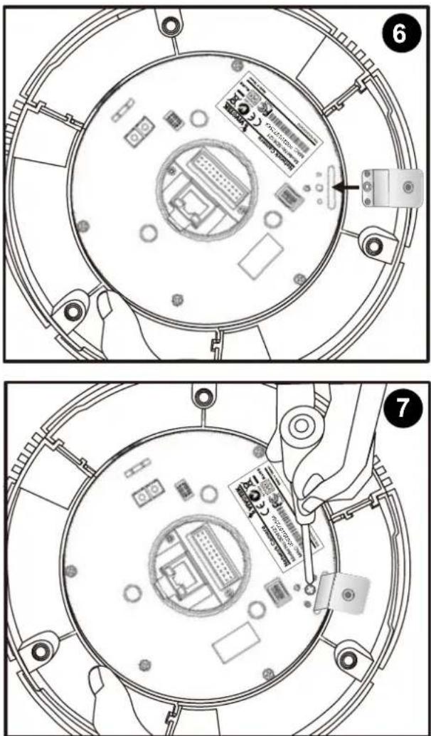 Technical diagram showing two views of a device's internal components with labeled parts and a hand inserting a card into a circular housing.