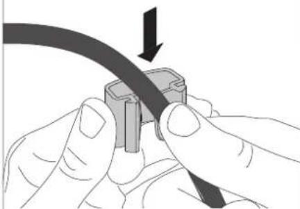 Close-up of hands connecting a cable to a connector (no text or symbols visible)