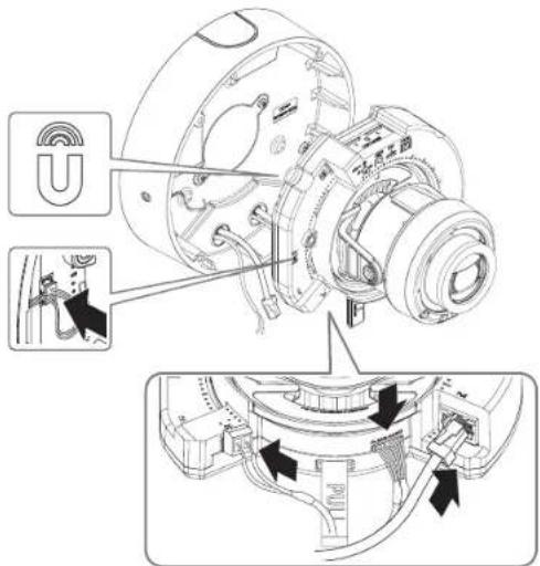 Technical diagram of a mechanical device with labeled components and directional arrows indicating assembly or operation.
