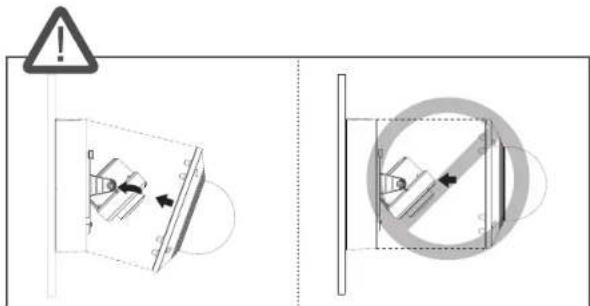 Safety warning diagram showing correct and incorrect installation of a mechanical component with directional arrows and a circular absence.