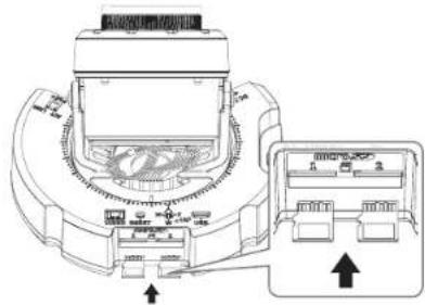 Technical diagram of a device with labeled ports and directional arrows indicating assembly or connection points