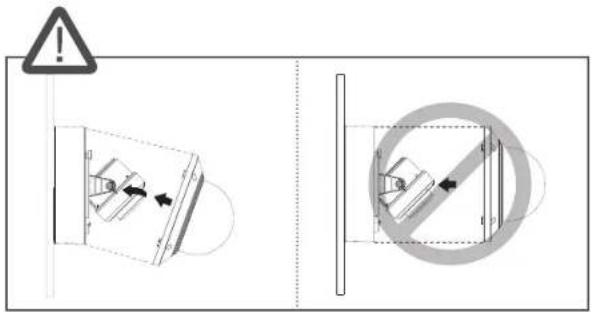 Technical diagram showing a warning sign and two mechanical components with directional arrows, likely indicating safety or hazard zones.