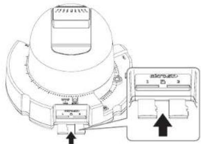 Technical diagram showing a mechanical component with labeled parts and an inset view of a device with numbered ports.