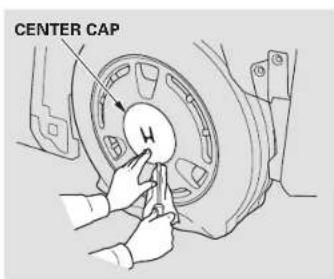 Honda Insight (2003) - Changing a Flat Tire - 3