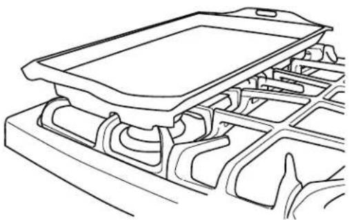 Adora JGB760EEFES - Placement of the Preseasoned Lodge Chef's Griddle over Left Grate - 1