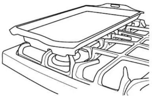 GE Profile PGB940DEFBB - Placement of the Preseasoned Lodge Chef's Griddle over Left Grate - 1