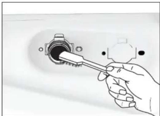 Hand holding a screwdriver inserted into a socket (no text or symbols visible)
