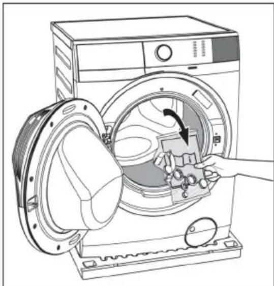 Line drawing of a washing machine with a hand inserting a component into the air gap.