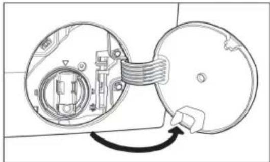 Diagram of a mechanical device with two circular components and a connecting belt, showing internal components without any text or symbols.