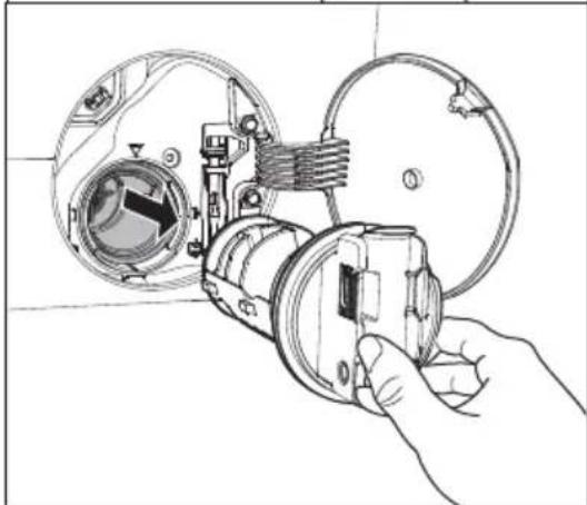 Line drawing of a hand holding a camera lens assembly, showing internal components and no text or symbols