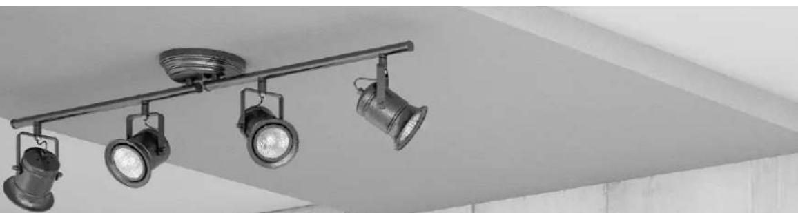 Black-and-white photo of a wall-mounted office lamp with three mounted cases, mounted on a pole (no text or symbols visible)