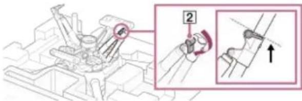Technical diagram showing mechanical assembly with labeled component '2' and directional arrow indicator