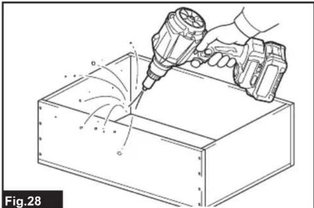 Illustration of a hand using a drill pen to lift or spread material from a rectangular box, with no visible text or symbols.