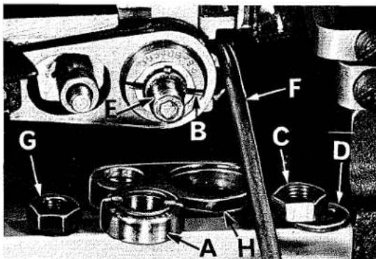 Labeled mechanical assembly diagram showing components A through H with numbered parts and directional arrows