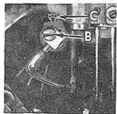 Close-up of a mechanical component with labeled parts (B, C) and no visible text or symbols