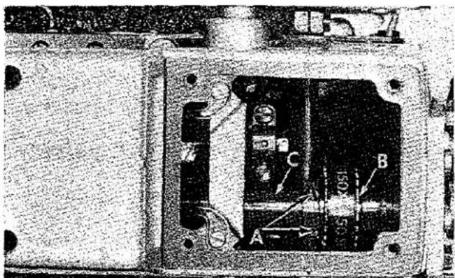 Interior view of an electronic device showing a circuit board with labeled components (A, B, C, S) and no readable text or symbols.