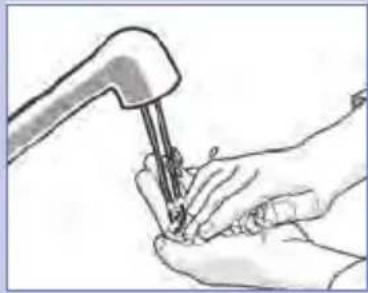 Illustration of hands using a tool to apply material or tools to a small object (no text or symbols visible)