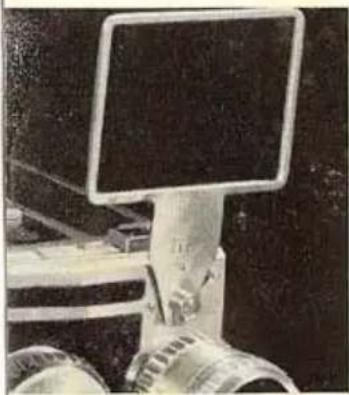 Close-up of a robotic arm with a mounted computer monitor (no visible text or symbols)
