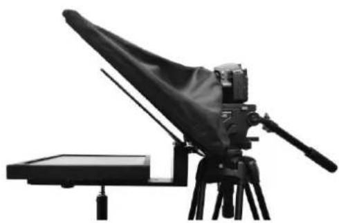 Black-and-white photo of a vintage camera or optical instrument mounted on a tripod, with no visible text or symbols.