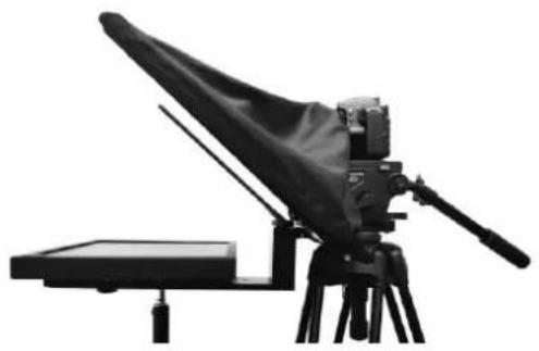 Black-and-white photo of a vintage camera setup with tripod-mounted device and base (no visible text or symbols)