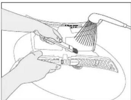 Illustration of hands using a tool to clean or adjust a component.