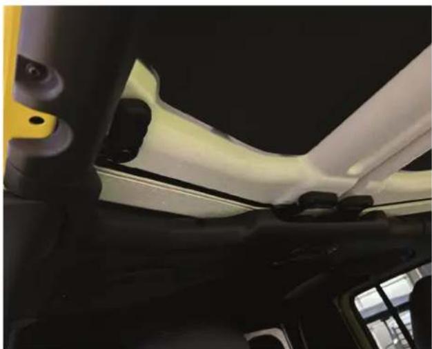 Interior view of a car showing white leather seatbelt and black dashboard (no visible text or symbols)
