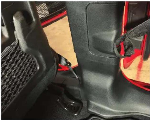 Close-up of a car seatbelt and seatbelt mechanism (no text or symbols visible)