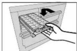 Hand inserting a grid into an open storage unit (no text or symbols visible).