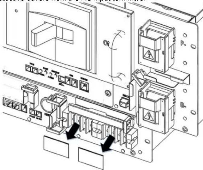 APC LIBATTSMGGIEC - Remove the protective covers from the AC input terminals. - 1