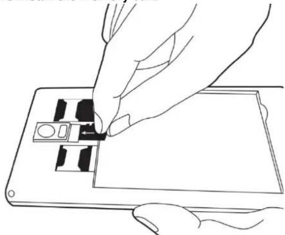 Line drawing of a hand inserting a small electronic component into a device (no text or symbols)