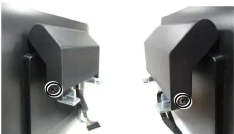 Close-up of two black industrial equipment components with circular features and connectors (no visible text or symbols)