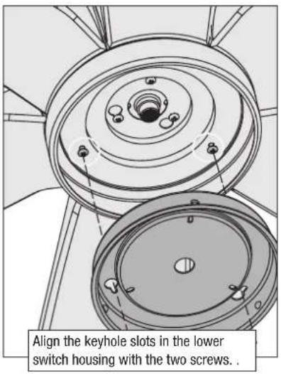 Align the keyhole slots in the lower switch housing with the two screws.
