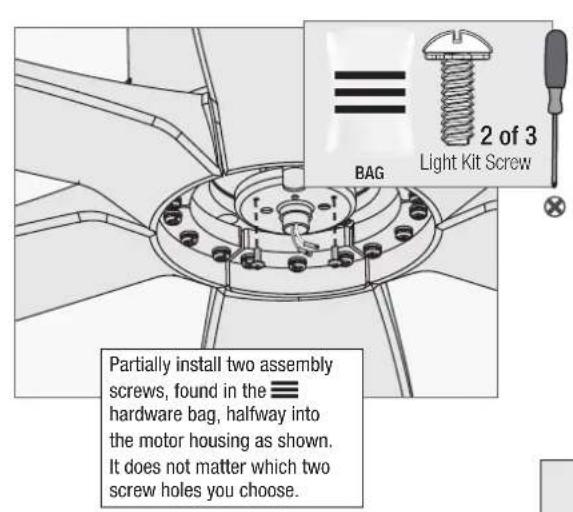 BAG 2 of 3 Light Kit Screw Partially install two assembly screws, found in the ≡ hardware bag, halfway into the motor housing as shown. It does not matter which two screw holes you choose.