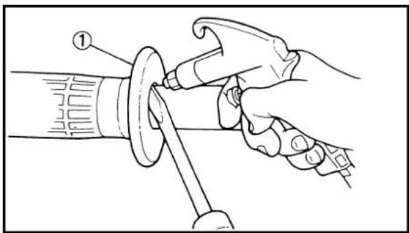 Technical diagram showing a hand using a tool to adjust or install a mechanical component, labeled with number 1.