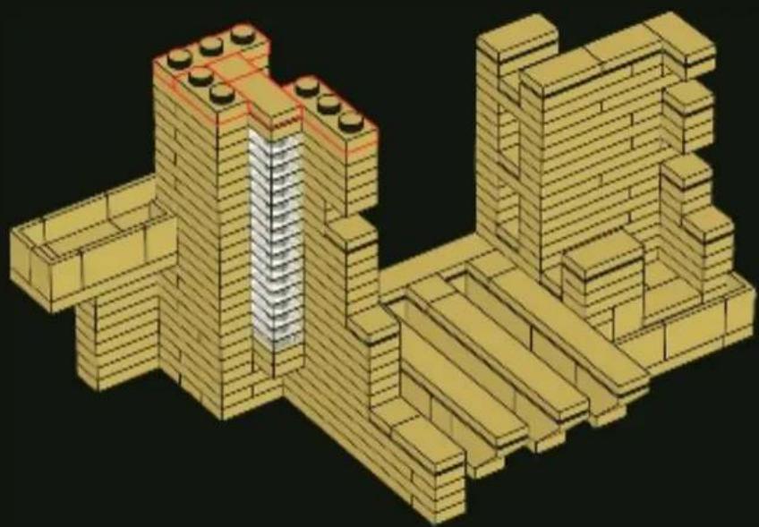 3D architectural model of a building structure with yellow and beige blocks, showing internal structural elements (no text or symbols)