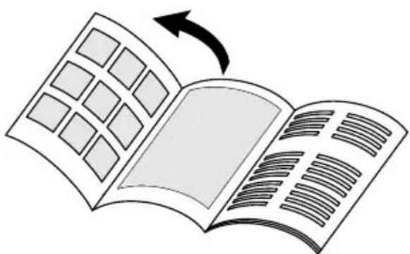 Illustration of an open book with grid pages and a curved arrow indicating rotation (no text or symbols)