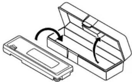 Technical line drawing of a mechanical component with an open lid and internal structure, showing rotational motion arrows (no text or symbols)