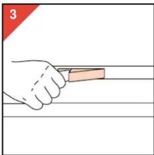 Illustration of a hand holding a tool with a pink object, no text or symbols present