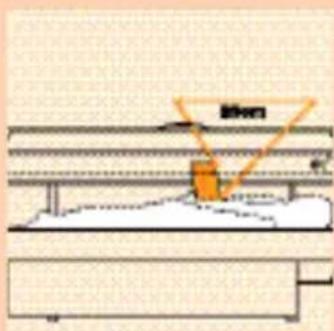 Technical diagram showing a structural assembly with labeled components and an orange triangular component, likely indicating a measurement or installation.