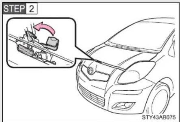 TOYOTA Yaris (2010) - Release the lock from the inside of the vehicle to open the hood. - 2