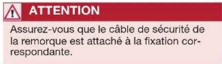 ATTENTION Assurez-vous que le câble de sécurité de la remorque est attaché à la fixation correspondante.