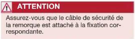 ATTENTION Assurez-vous que le câble de sécurité de la remorque est attaché à la fixation correspondante.
